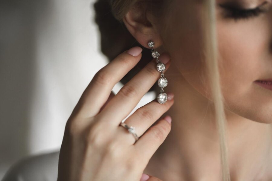 wedding-earrings-womans-hand-she-takes-earrings-bride-fees-morning-bride